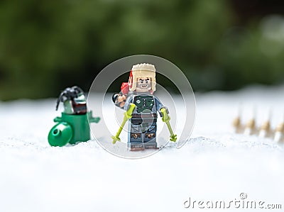 lego star wars minifigure bounty hunter Boba fett trekking on snow Editorial Stock Photo