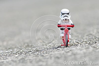 Lego storm trooper riding bicycle. Editorial Stock Photo