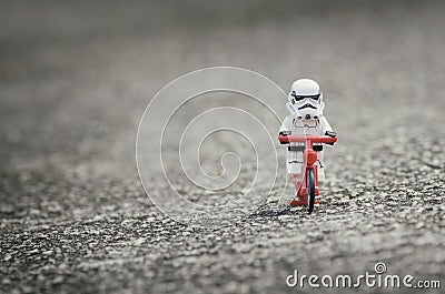 Lego storm trooper riding bicycle. Editorial Stock Photo