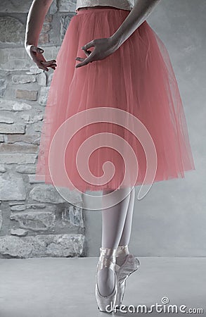 Legs of ballerina with pointe shoes in fifth position Stock Photo