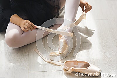 Legs and black fluffy skirt of little balerina Stock Photo