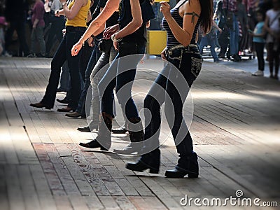 Legs close up of traditional western folk music dancers blur dynamism effect Stock Photo