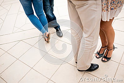 Legs of couples dancing argentinian tango seen from above outdoors on pavement moving and elegantly dressed Stock Photo