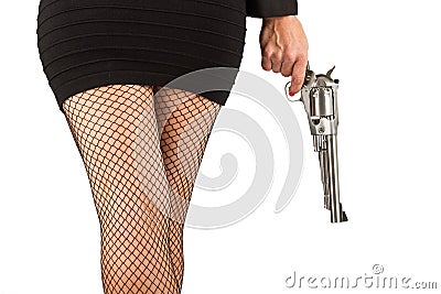 Legs of dangerous woman with handgun and black shoes Stock Photo