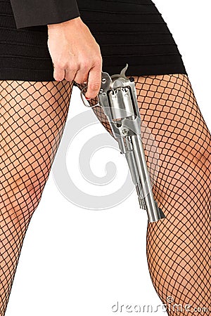 Legs of dangerous woman with handgun and black shoes Stock Photo