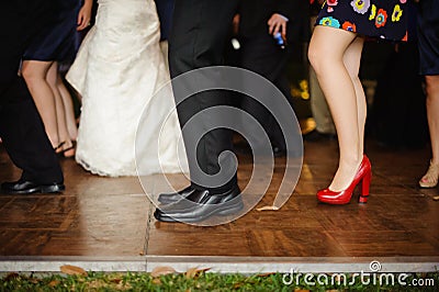 Legs down image of people dancing at wedding reception. Stock Photo