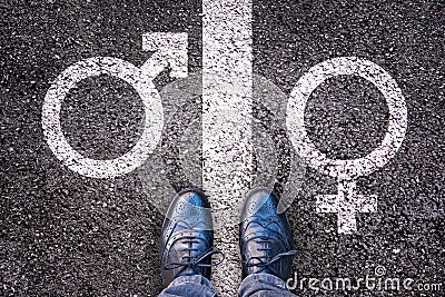 Legs with gender symbol on asphalt Stock Photo