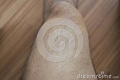 Legs hair of asian man close up Stock Photo