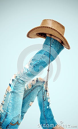 Legs with hat on blue Stock Photo