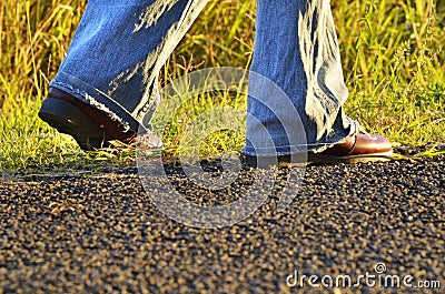 Legs hiker boots shoes woman walking country road Stock Photo