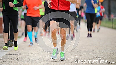Legs of runners at footrace race in the city Stock Photo