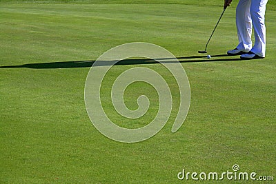 Legs of person playing golf Stock Photo