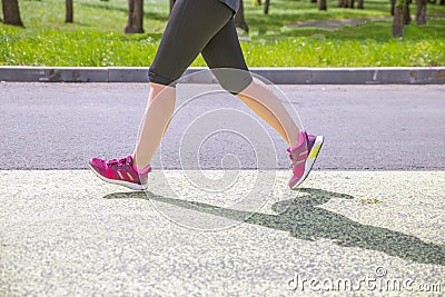 Legs of a running athlete for a long distance Editorial Stock Photo