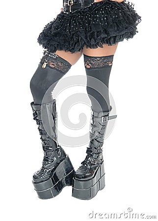 Legs of woman in long black boots. Stock Photo