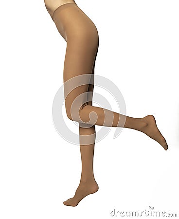 Legs of young caucasian woman in nylon tights on white background Stock Photo