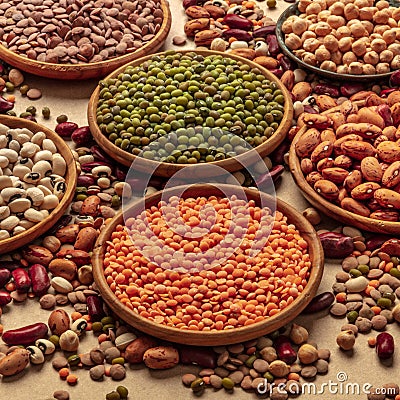 Legumes assortment on a brown background. Lentils, soybeans, chickpeas etc Stock Photo