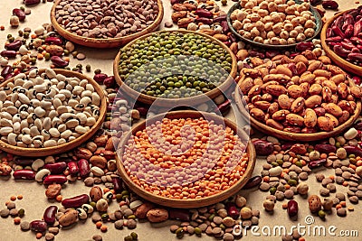 Legumes assortment on a brown background. Lentils, soybeans, chickpeas, red kidney beans Stock Photo