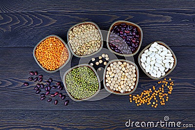 Legumes and beans assortment in bowls: lentils, beans, mung and chickpeas Stock Photo