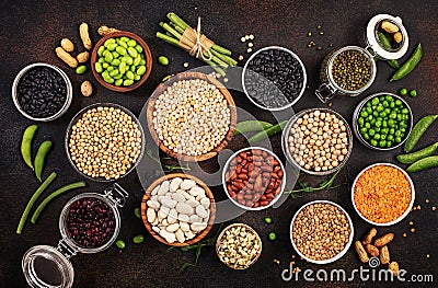 Legumes, beans and sprouts. Dried, raw and fresh, top view. Red kidney beans, lentils, mung beans, chickpeas, soybeans, edamame, Stock Photo