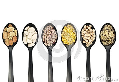 Legumes over spoons Stock Photo