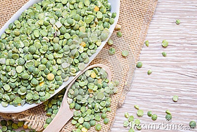 Legumes, soup peas are scattered over the cloth mat. Stock Photo
