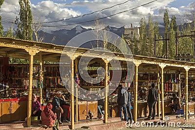 Tourist souvenir market on the background of snowy mountains Editorial Stock Photo