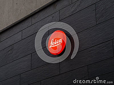 Leica Camera Logo on a Dark Wall Editorial Stock Photo