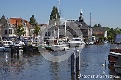 Historical harbour building the Volharding in the summer season in Leiden Editorial Stock Photo