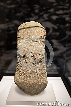 Leiden, The Netherlands - JAN 04, 2020: closeup of an ancient dolerite stone anthropomorphic human figurine from ancient Cyprus. Editorial Stock Photo