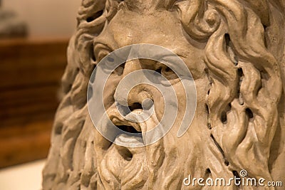Sea god Okeanos on marble puteal from ancient Greece. Ancient greek empire. Face of man with beard. Greek Mythology. Editorial Stock Photo