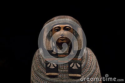 An old wooden sarcophagus from ancient egypt at the exhibition Gods of Egypt. Editorial Stock Photo