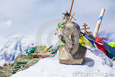 Lenin head statue at the top of Lenin Peak, Pamir Mountains Stock Photo