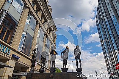 Leipzig, Germany - June 25, 2022: View of Grimmaische Strasse with the Untimely Contemporaries statue unzeitgemaesse zeitgenossen Editorial Stock Photo