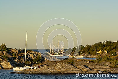 Leisureboats moored to cliffs HuvudskÃ¤r Stockholm achipelago Editorial Stock Photo