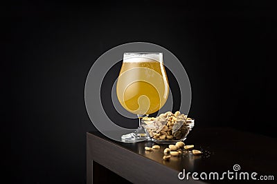 Lemon beer and bowl of peanuts Stock Photo