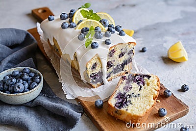Lemon blueberry loaf of bread cake with sugar glaze Stock Photo