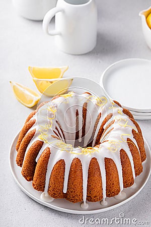 Lemon bundt cake with sugar powder vanilla icing Stock Photo