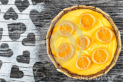 Lemon custard tart, decorated with biscuits, top view, close-up Stock Photo