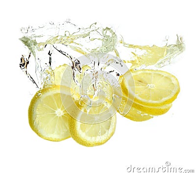 Lemon is dropped into water Stock Photo