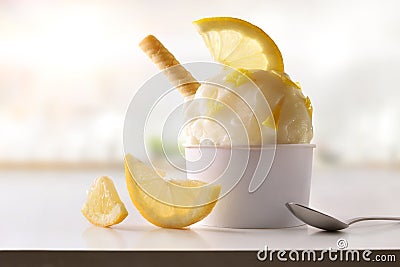 Lemon ice cream cup on white table homemade in kitchen Stock Photo