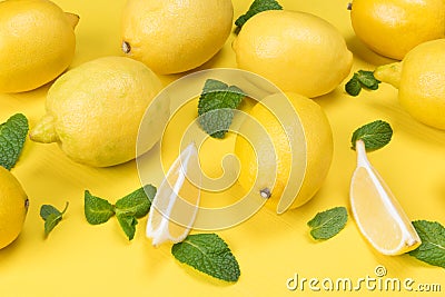 lemon and its lobules on a yellow table Stock Photo