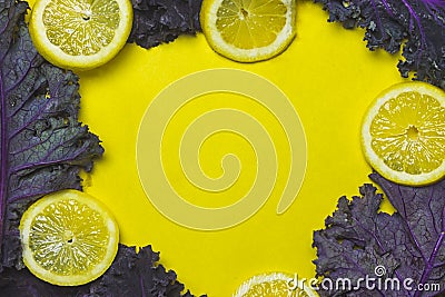 Lemon and Kale Frame on Yellow Background Stock Photo