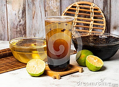 Lemon Love Jade Powder Balls tea served in disposable cup isolated on table side view taiwan style Stock Photo