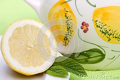 Lemon part with a jug of water Stock Photo