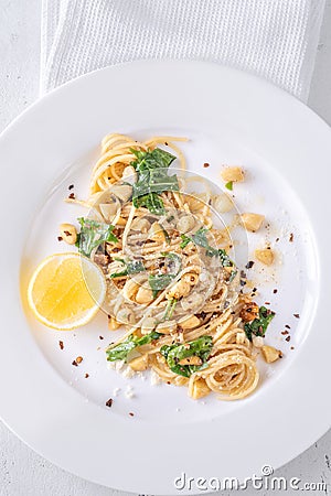 Lemon pasta with almonds Stock Photo