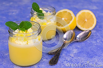 Lemon pudding on a blue background. Delicate lemon dessert. Stock Photo