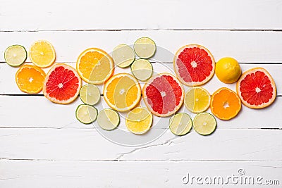 Lemon, tangerine, orange and pink grapefruit on white wood Stock Photo