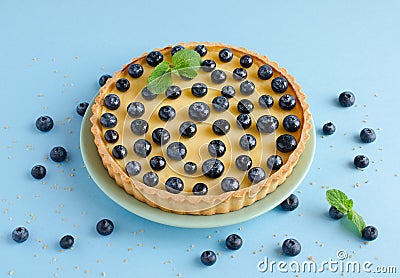 Lemon tartlet decorated with blueberries and mint Stock Photo