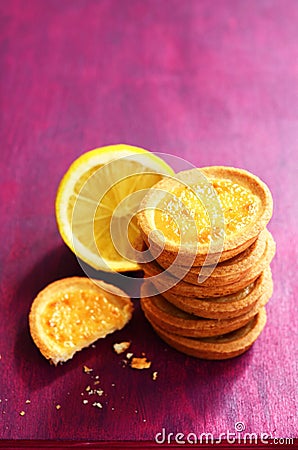 Lemon tartlets on deep pink background Stock Photo