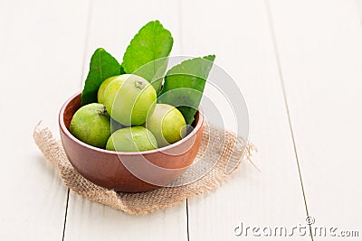 Lemon on a wooden cup Stock Photo